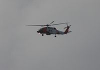 6008 - MH-60J Coast Guard flying along Passe A Grille Beach south of St. Pete FL at dusk