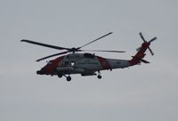 6008 - Coast Guard MH-60J flying along Passe A Grille Beach by St. Pete before dark