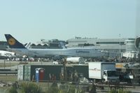 D-ABVC @ MIA - Lufthansa 747-400 taken thru windshield of car at MIA