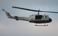 N416NA - NASA UH-1B flying along Indian River at Titusville