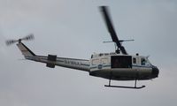 N416NA - NASA UH-1B flying over Indian River near Titusville