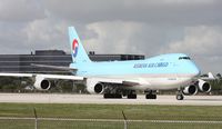 HL7601 @ MIA - After about 3 planes landed, the Korean 747 now cleared for take off on 9