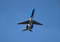 N949AT @ MCO - Air Tran Orlando Magic belly shot as it flies over Orlando Executive Airport