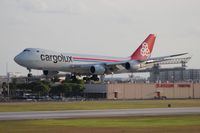LX-VCB @ MIA - Cargolux 747-800 with the famous El Dorado Furniture building in the background, where a majority of MIA arrival shots are taken from