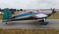 N540WS @ LAL - Bill Stein Aerosports Edge 540 changes from purple to green as it moves by