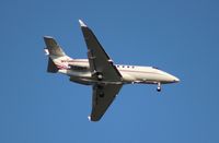 N899QS @ MCO - Net Jets Hawker 900XP
