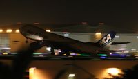 JA12KZ @ LAX - NCA Cargo 747-8 operating in the dark, shot from hotel