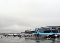 Dallas/fort Worth International Airport (DFW) - South gates at Terminal D - Cold rainy day - Korean Air HL7751 at the gate along with the commuters - by Zane Adams