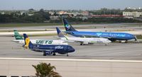 Fort Lauderdale/hollywood International Airport (FLL) - 4 special paint aircraft lined up in a row - by Florida Metal
