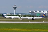 Munich International Airport (Franz Josef Strauß International Airport) - Munchen Airport, tower and part of the terminal and runway in front of the taxyways. View from spotting mount. - by FerryPNL
