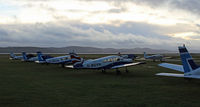 Dundee Airport - Sunset line-up of Tayside Aviation trainers - by Clive Pattle