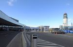 Vienna International Airport - streetside view of terminals and tower at Wien airport - by Ingo Warnecke